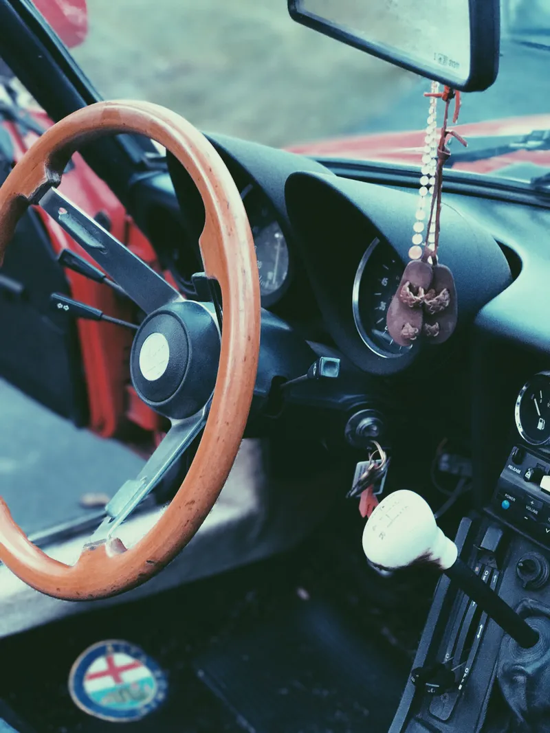 Car accessories category with a classic car's wooden steering wheel and dashboard